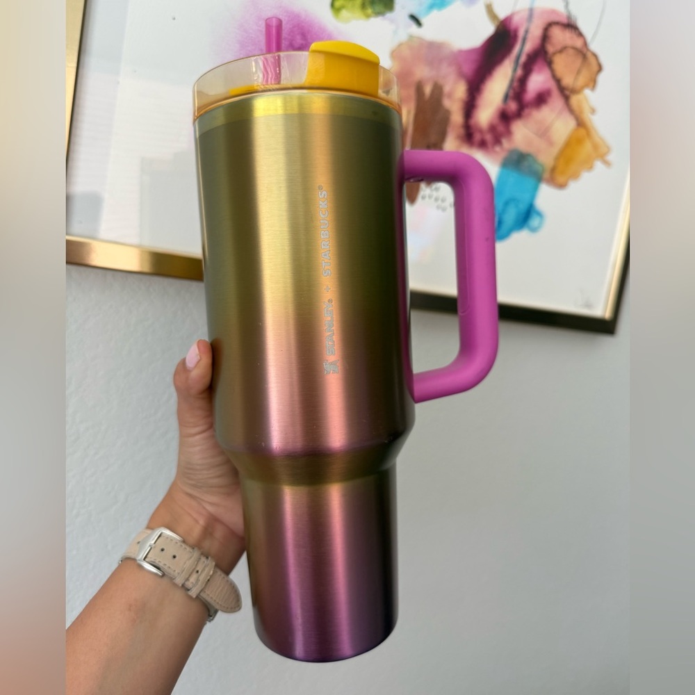 Stanley iridescent travel mug with pink handle and yellow lid